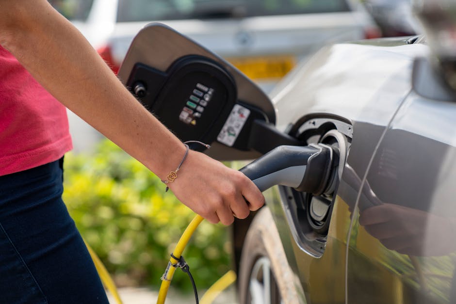 EV charging plug connected to a car